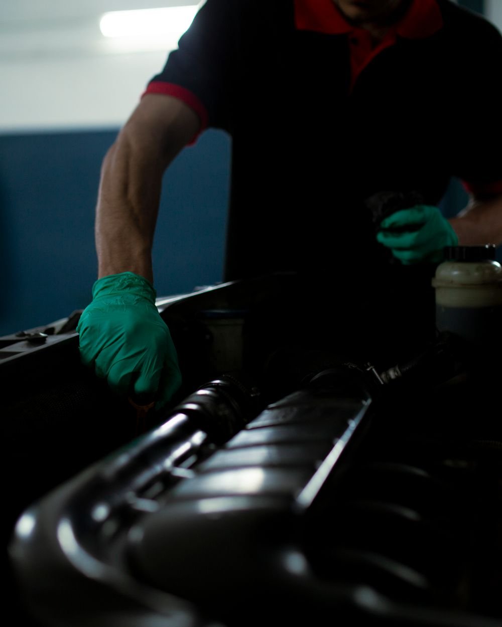 Demo image: mechanic working in an engine bay